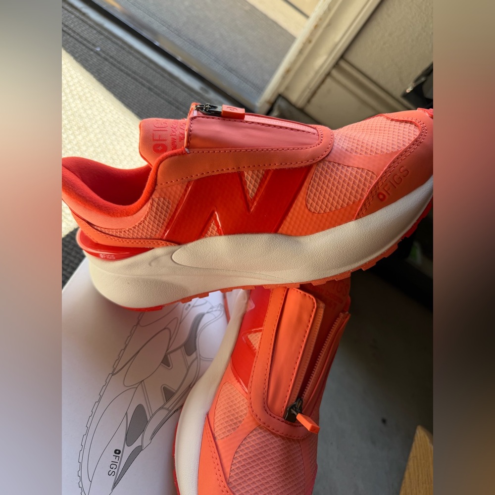 New Balance Women’s Coral Orange Zip-Front Sneakers